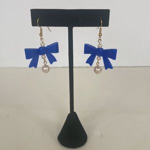 Z57 New (without tags) Costume jewelry- Dangle earrings that has blue bows.